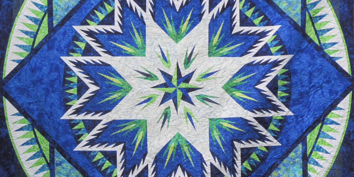 Beautiful quilt finished with custom long-arm quilting by Quilt Me Studio